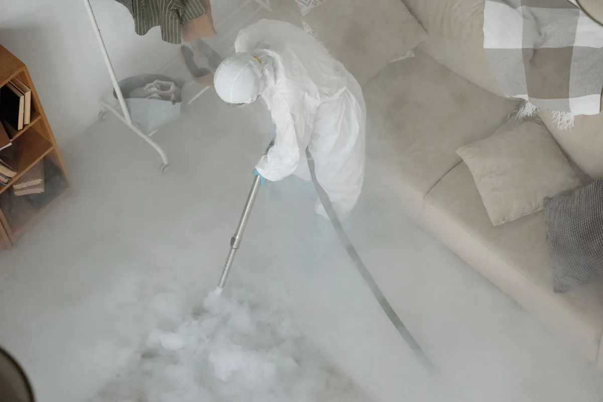 Biohazard cleanup technician in protective equipment, Somers, MT